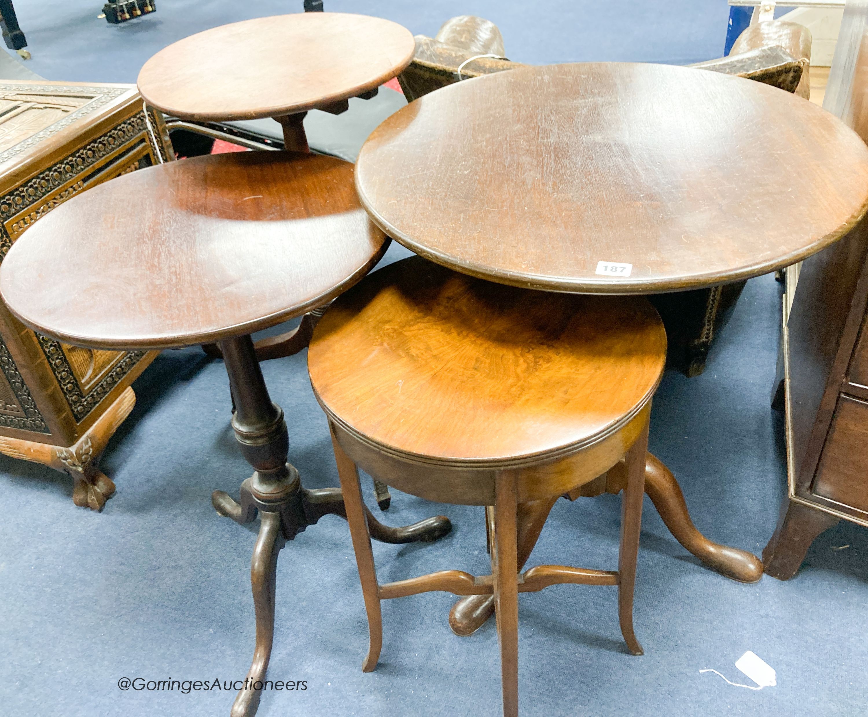 Three George III and later circular mahogany tripod tables, largest diameter 60cm together with a 1920's walnut circular occasional table